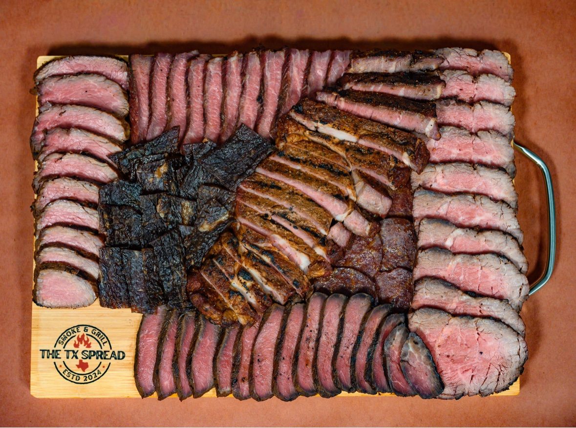 The Pitmaster board — the fullest Tx Spread board, packed with rows of sliced smoked meats